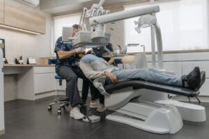 A Dentist in a Clinic Working on a Patient